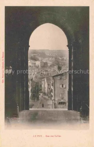 AK / Ansichtskarte Le Puy-en-Velay 43 Haute-Loire Rue-des-Tables Kathedralportal Romanischer-Bogen Gasse Altstadt Daecher Fussgaenger Laterne