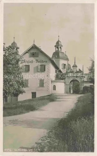 AK / Ansichtskarte Schloss Velden Woerther See Kaernten AT Schloss Eingangstor Turm Weg Baeume Torbogen