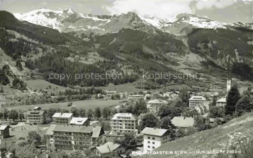 AK / Ansichtskarte BAD HOFGASTEIN Pinzgau Salzburg AT Bad-Hofgastein Hundskopf Alpendorf Berge Schnee Kirche Wald Wiese