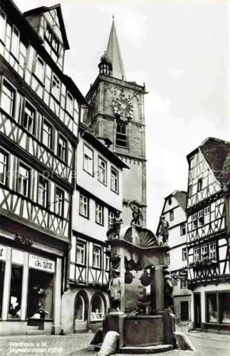 AK / Ansichtskarte Wertheim Main BW Engelbrunnen Kirchturm Fachwerk Brunnen Altstadt Uhr Markt