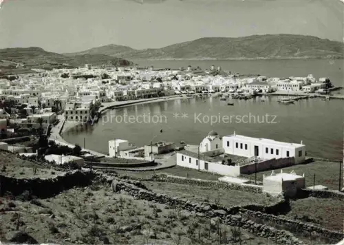AK / Ansichtskarte Mykonos Micono Myconos Greece Hafen Bucht Weisshaeuser Kirche Segelboote Insel Kueste Bergpanorama