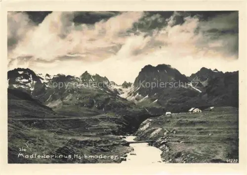 AK / Ansichtskarte Madlenerhaus 1986m Montafon AT Madlenerhaus Hohmaderer Berge Alpenbach Almhuette Wolken