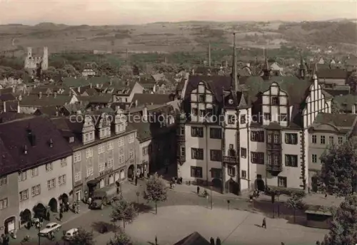 AK / Ansichtskarte Saalfeld Saale Thueringen HO-Hotel-Goldener-Anker Rathaus Marktplatz Stadtansicht Fachwerkhaus Kirche Huegel Passanten