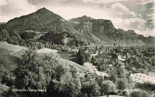 AK / Ansichtskarte Dornbirn Vorarlberg AT Stadtpanorama Berge Alpen Kirche Daecher Obstgaerten Wiesen Fabrik