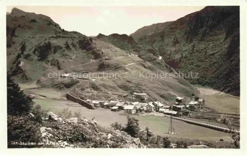 AK / Ansichtskarte Stuben Arlberg Flexenstrasse Vorarlberg AT Arlberg Bergdorf Kirche Tal Berge Strasse Stromleitung