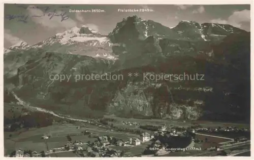 AK / Ansichtskarte Kandersteg BE Doldenhorn Fisistoecke Kandersteg Bergpanorama Ortschaft Tal Wiesen Kirche Dorf