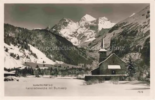 AK / Ansichtskarte Kandersteg BE Katholischekirche Bluemlisalp Kirchturm Winterlandschaft Schnee Wald Berge Tal