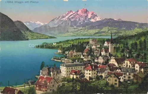 AK / Ansichtskarte Weggis Vierwaldstaettersee LU Pilatus Vierwaldstaettersee Seeufer Kirchturm Hotels Dorf Berge Panorama