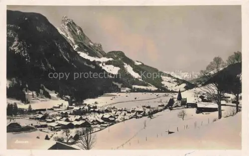 AK / Ansichtskarte Saanen BE Winterlandschaft Berge Schnee Kirche Dorf Tal Wald