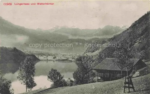 AK / Ansichtskarte Lungernsee Lungern Obwalden OW Lungernsee Wetterhoerner See Berge Bauernhaus Wiesen Wald Tal