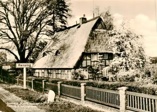 AK / Ansichtskarte Rensing Kellinghusen Schleswig-Holstein Gasthaus-Doppeleiche Reetdachhaus Fachwerkhaus Garten Ortsschild Kirschbluete Holzzaun