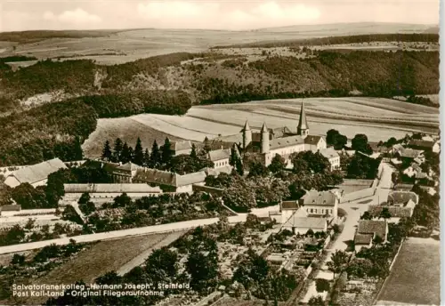 AK / Ansichtskarte Steinfeld Kall Eifel Euskirchen NRW Salvatorianerkolleg Hermann-Joseph Kloster Kirche Fliegeraufnahme Eifel Felder