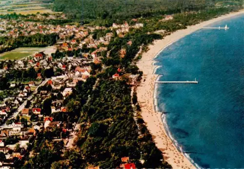 AK / Ansichtskarte Timmendorferstrand Timmendorf  Timmendorfer Strand Fliegeraufnahme Strand Ostsee Seebruecke Strandkoerbe Badeort Villen Wald