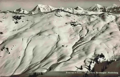 AK / Ansichtskarte Saanenmoeser Zweisimmen BE Barwengen Rinderberg Skigelaende Winterlandschaft Schnee Bergkette Huette