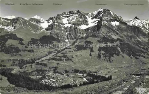 AK / Ansichtskarte Adelboden Frutigen BE Sesselbahn Schwandfeldspitz Bluemlisalp Fruendhorn Doldenhorn Nuenihorn Grosslohner Tschingellochtighhorn Bergkette Tal