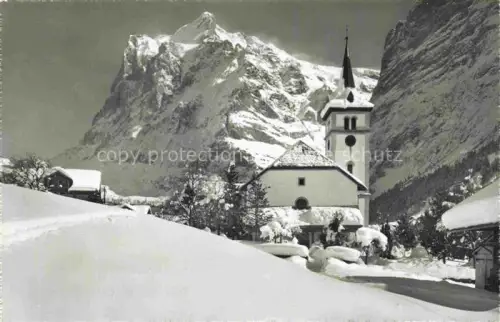 AK / Ansichtskarte Grindelwald BE Kirche Wetterhorn Schnee Winter Dorf Berge Kirchturm
