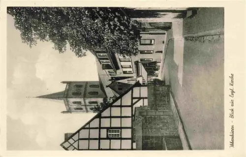 AK / Ansichtskarte Ibbenbueren NRW Evangelische-Kirche Fachwerkhaus Strasse Kirchturm Geschaeft S/W-Foto