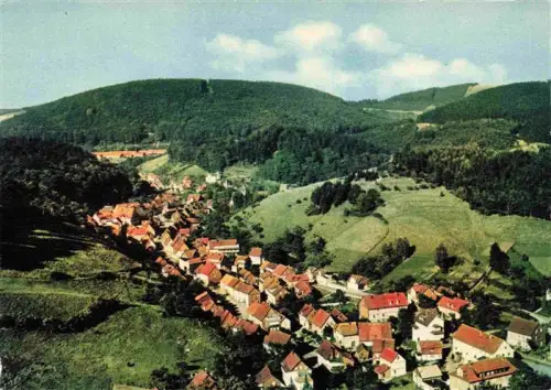 AK / Ansichtskarte Bad Grund Harz Osterode Niedersachsen Oberharz Luftaufnahme Ortschaft Waelder Huegel Taelder Rote-Daecher