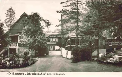 AK / Ansichtskarte FREIBERG  Sachsen Gaststaette-Schroedermuehle Gaststaette Holzhaus Garten Baeume Terrasse