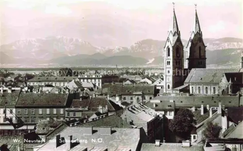 AK / Ansichtskarte Neustadt WIEN Wiener-Neustadt AT Stadtpanorama Kirche Tuerme Schneeberg Alpen Daecher
