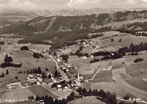 AK / Ansichtskarte Jungholz Ausserfern Tirol AT Fliegeraufnahme Dorf Kirche Felder Wald Huegel 1150m
