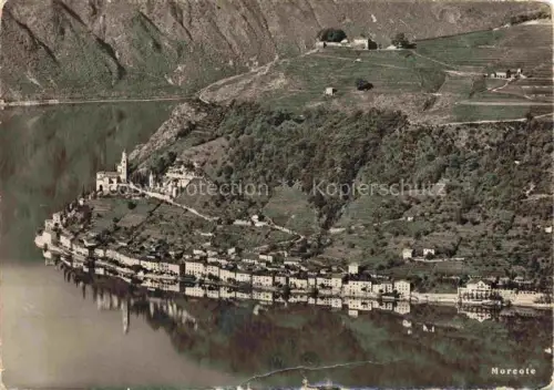 AK / Ansichtskarte Morcote Lago di Lugano TI Fliegeraufnahme See Lago-di-Lugano Kirche Dorf Weinberge Berge Uferpromenade