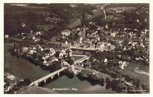 AK / Ansichtskarte Schwandorf Bayern Fliegeraufnahme Fluss Bruecke Altstadt Kirche Wohnhaeuser Wald Luftbild