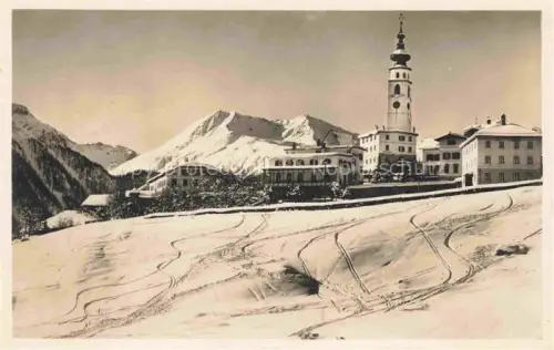 AK / Ansichtskarte Fetan Ftan GR Kirchturm Dorf Schnee Berge Unterengadin Winterlandschaft Hotel