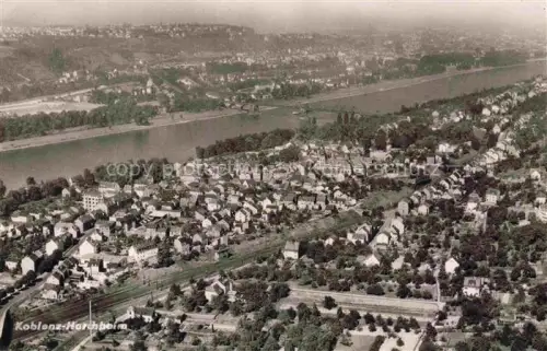 AK / Ansichtskarte Horchheim Koblenz Rheinland-Pfalz Horchheim Rhein Luftbild Siedlung Bahnlinie Kirche Stadtansicht
