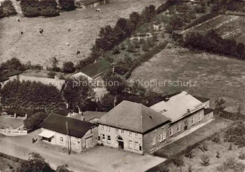 AK / Ansichtskarte Tornesch Pinneberg Schleswig-Holstein Mohnkes-Gasthof Gasthof Fliegeraufnahme Felder Kuehe Luftbild Uetersen