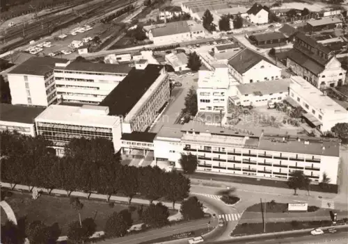 AK / Ansichtskarte Gruenwettersbach KARLSRUHE BW Werksanlagen Fabrik Luftbild Industriegebaeude Bahngleise Parkplatz Strassenkreuzung