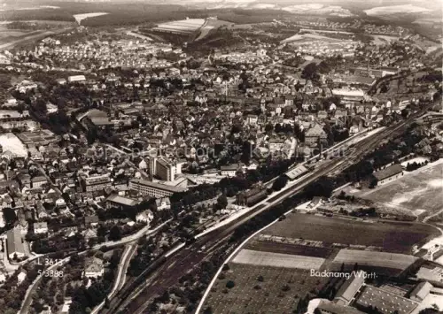 AK / Ansichtskarte Backnang Rems-Murr-Kreis BW Stadtpanorama Bahnhof Eisenbahn Haeuser Felder Luftbild