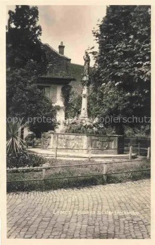 AK / Ansichtskarte LUZERN  LU Brunnen Hofkirche Statue Kopfsteinpflaster Baeume Wohnhaus Madonna