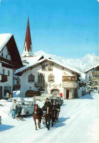 AK / Ansichtskarte SEEFELD Tirol AT Wetterstein Dorfplatz Pferdeschlitten Kirche Lueftlmalerei Schnee Winter Wintersportort Berge