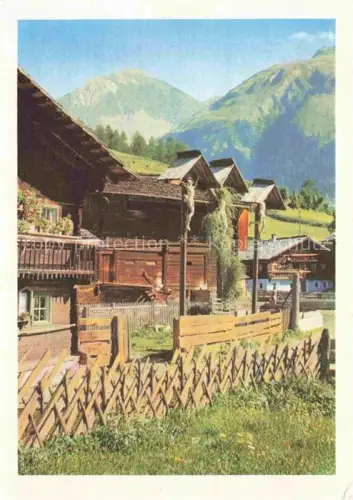 AK / Ansichtskarte Kals-Lesach Grossglockner Tirol AT Bauernhof Holzhaus Wegkapelle Kruzifix Berge Almlandschaft Dorf
