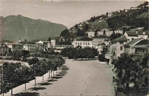 AK / Ansichtskarte Muralto Locarno Lago Maggiore TI Allee Stadtplatz Berg Palme Haeuser Kirche Lago-Maggiore Stadtansicht