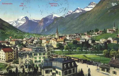 AK / Ansichtskarte Schwanden Glarus GL Toedi Gemsfayren Bahn Zug Stadtansicht Kirche Berge Schnee