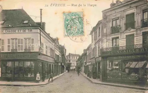 AK / Ansichtskarte EVREUX 27 Eure Rue-de-la-Harpe Strassenszene Geschaefte Quincaillerie Jagdwaffen Passanten Kopfsteinpflaster
