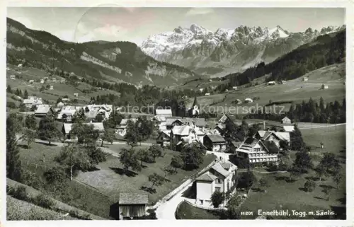 AK / Ansichtskarte Ennetbuehl Toggenburg SG Dorfansicht Saentis Berge Kirche Wiesen Toggenburg