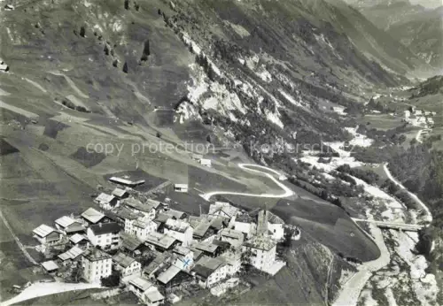 AK / Ansichtskarte Villa Bedretto Leventina TI Bedretto Luftbild Dorf Bergtal Alpen Kurve Strasse Daecher