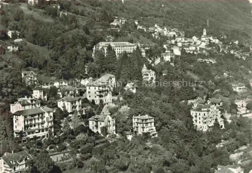 AK / Ansichtskarte Orselina Locarno TI Villen Wohnhaeuser Wald Berghang Kirche Luftaufnahme