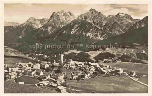 AK / Ansichtskarte Fetan Ftan GR Unterengadin Bergdorf Kirche Bergpanorama Felsberge Wiesen Talblick