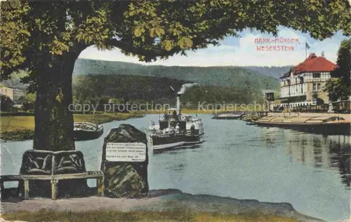 AK / Ansichtskarte Hann. Muenden Weserstein Dampfschiff Weser Fluss Uferpromenade Gebaeude Baeume Denkmal