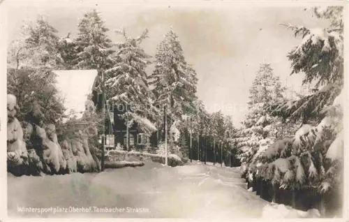 AK / Ansichtskarte Oberhof Thueringen Tambacher-Strasse Winterlandschaft Schnee Tannen Holzhaus Wintersportplatz