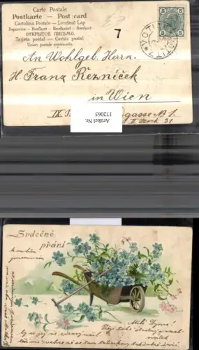 172065,Künstler Ak Präge Litho blaue Blumen Schubkarren