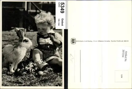 207234,SOS Kinderdorf 3euro59 Kind Junge sitzt b. Hasen m. Ostereier a. Wiese Schneeglöckchen