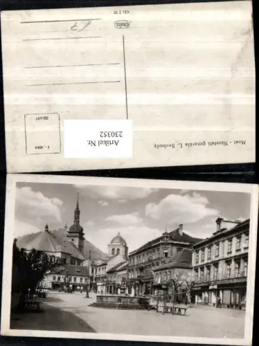 230352,Brüx Most Namesti generala L. Svobody Straßenansicht Brunnen Kirche Geschäfte