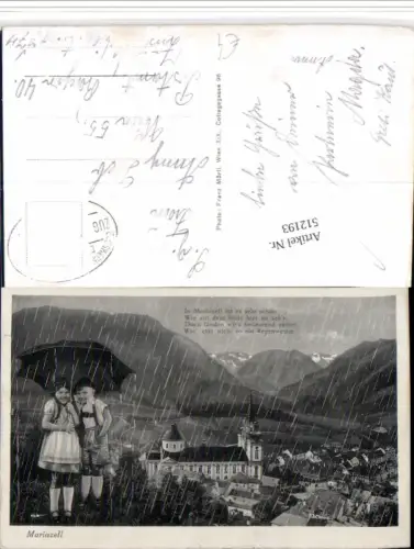 512193,Mariazell Teilansicht Kirche Bergkulisse Kinder Tracht Regen