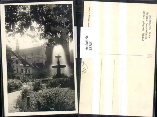 183785,Judenburg Ortsansicht Kirche Turm Brunnen