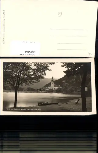 668564,Foto Ak Nassereith a. d. Fernpaßstraße Ruderboot a. Ufer